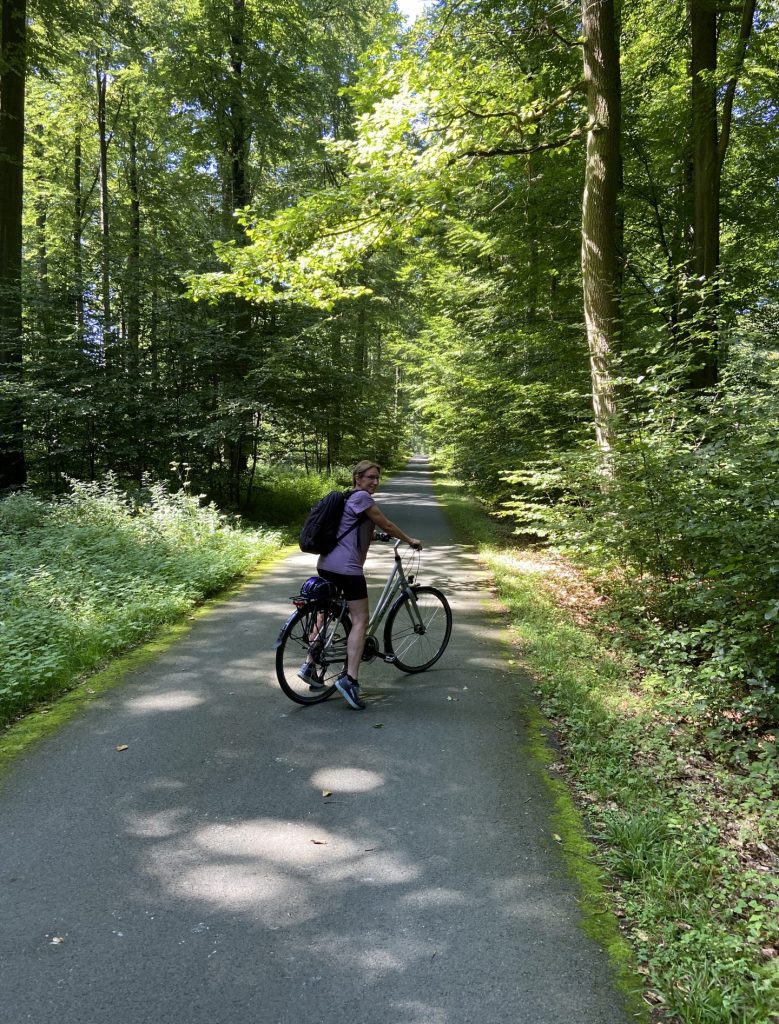 Patricia on a bike in the forest