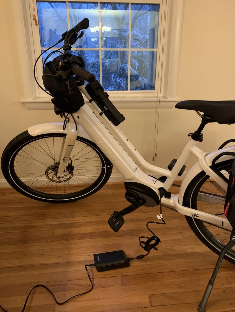 An e-bike charging at home