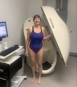 Patricia and the bod pod. Health coach. Woman over 50.