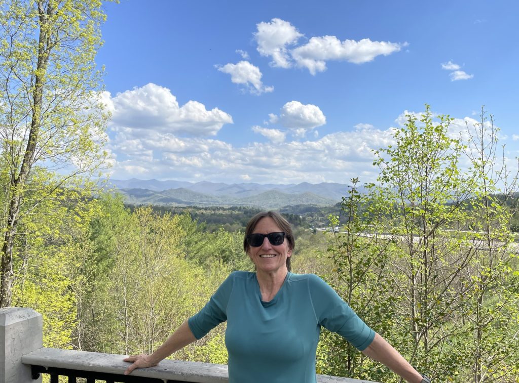 Patricia out in nature. Woman over 50. Health coach.