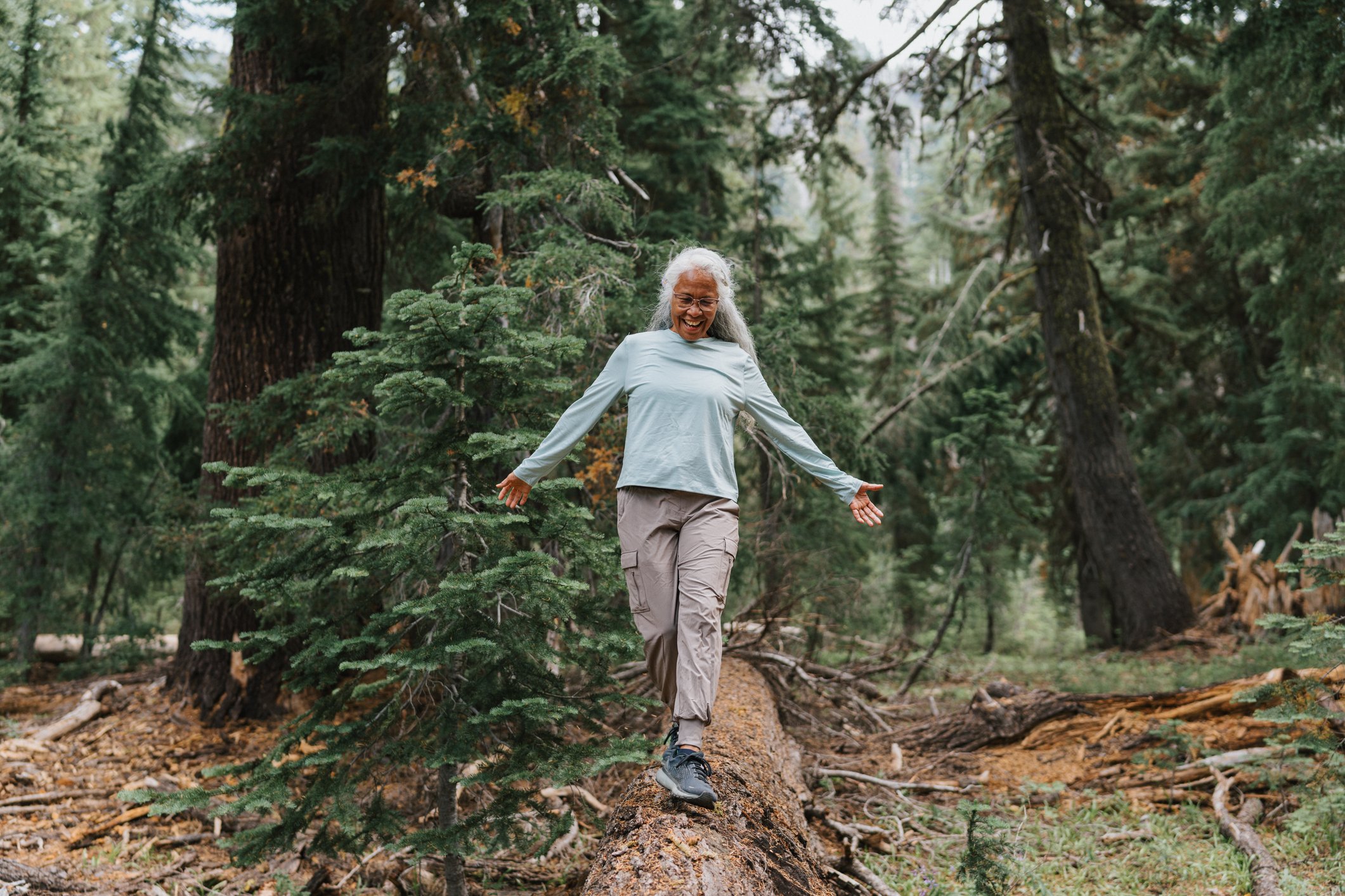 Woman balancing in the woods