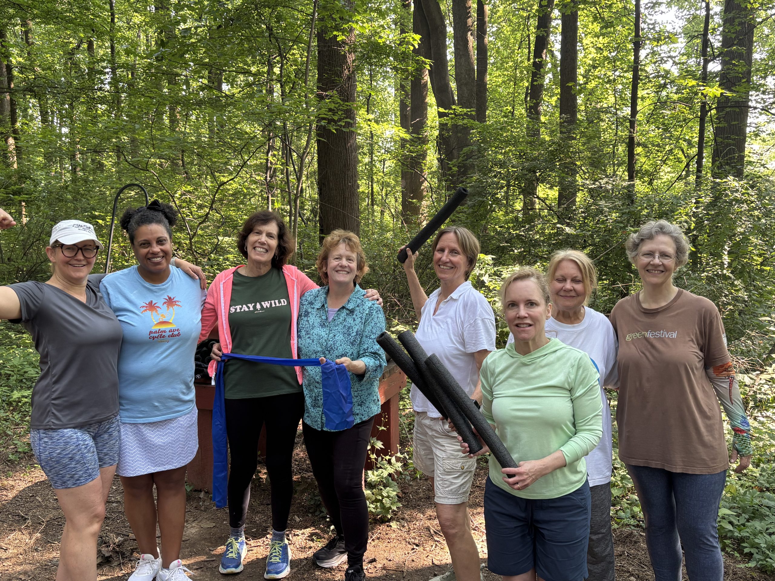 Happy group of women in the forest. Women over 50. Health coach. Exercise.